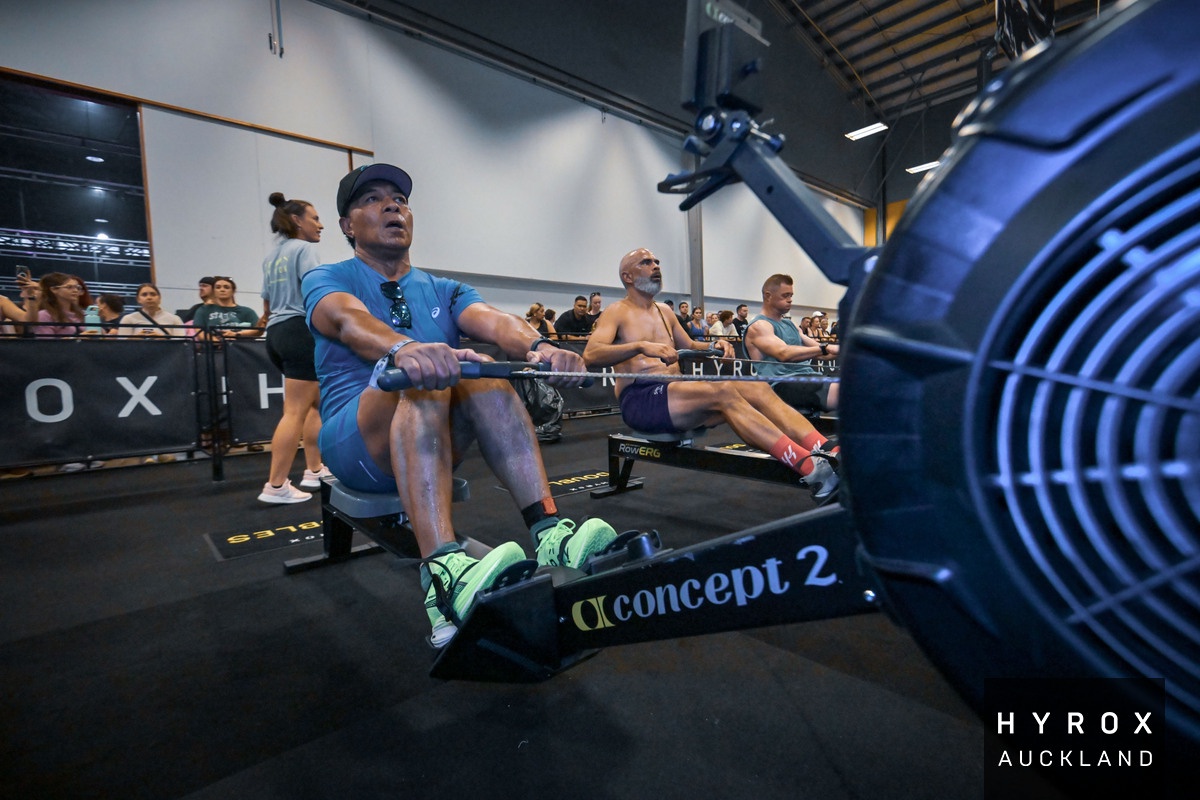 Athlete performing sandbag lunges at a HYROX event