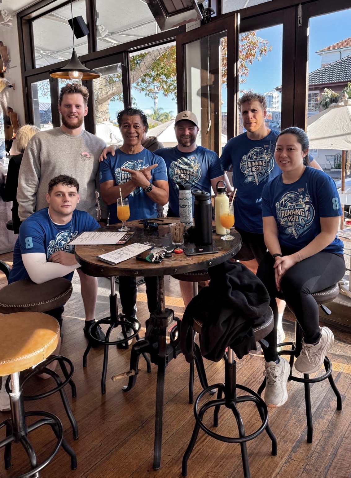 Group of runners celebrating after a run